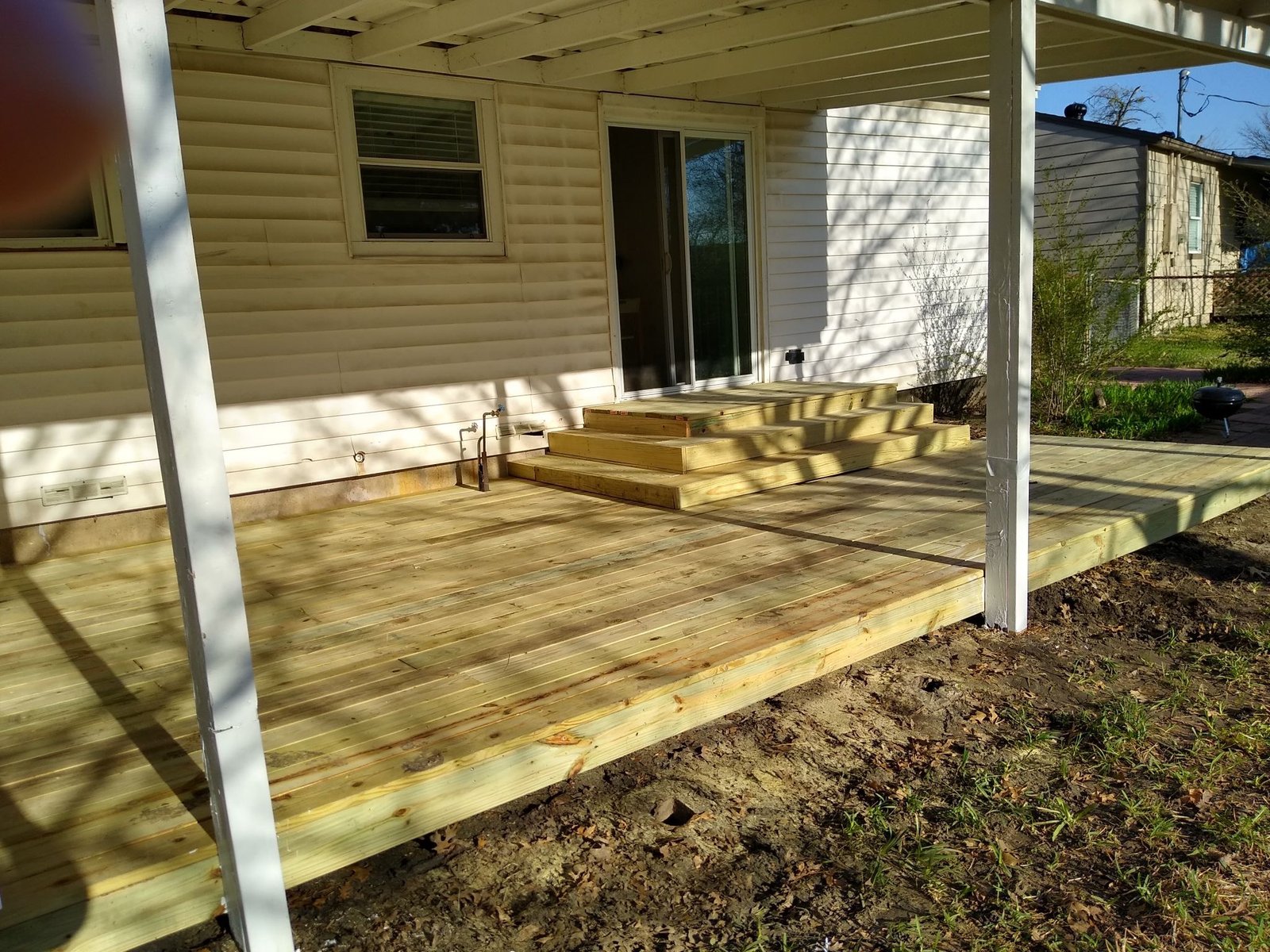 Large backyard wood deck installation