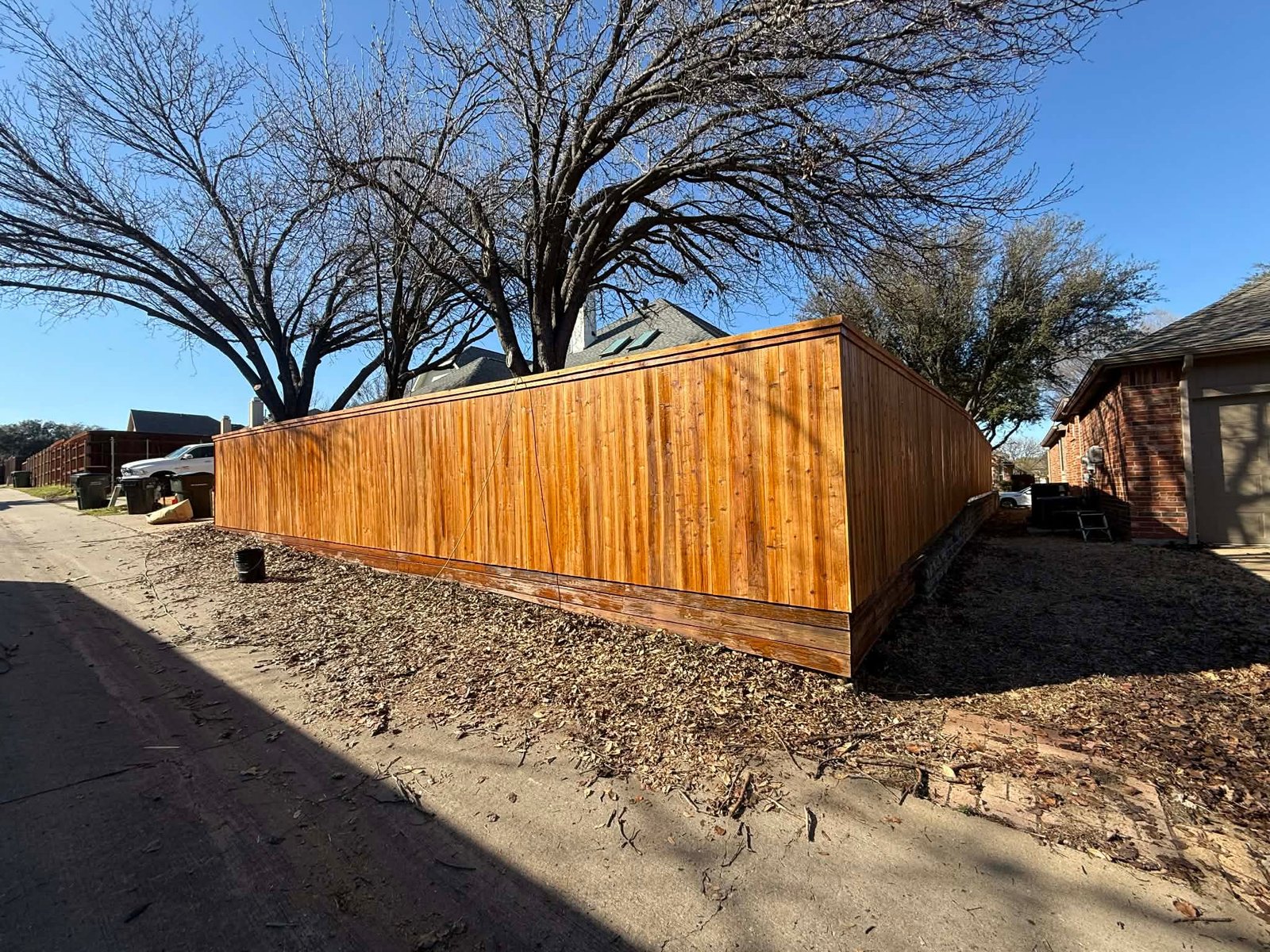 Finished stained wood privacy fence by JTX Fence